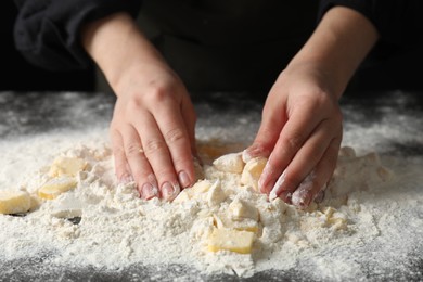 Photo of Woman making shortcrust pastry at table, closeup
