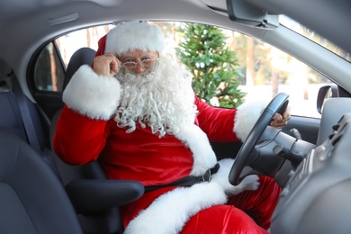 Photo of Authentic Santa Claus driving car, view from inside