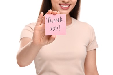 Woman holding paper note with phrase Thank You on white background, closeup