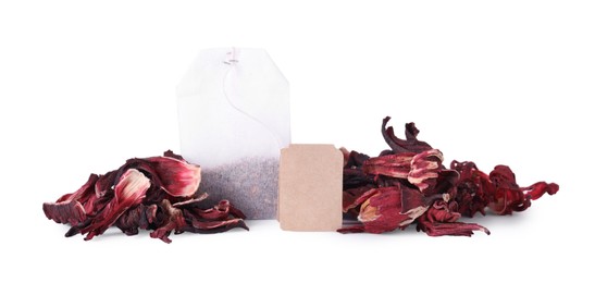 Photo of Pile and bag of dry hibiscus tea isolated on white