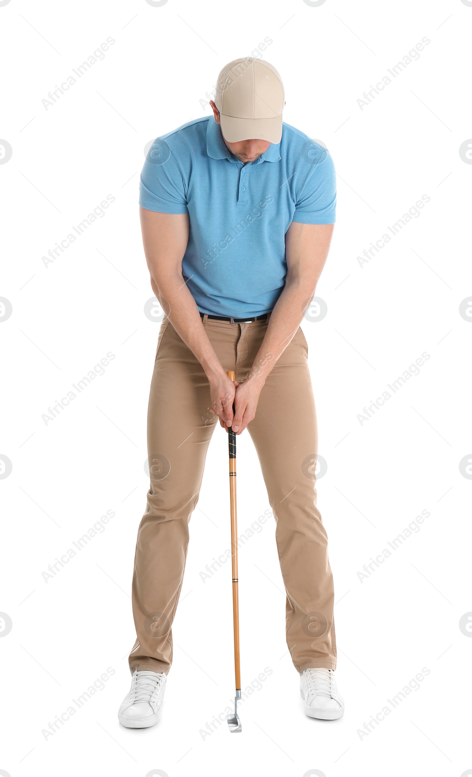 Photo of Young man with golf club isolated on white