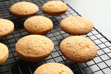 Photo of Baking grid with Danish butter cookies on table