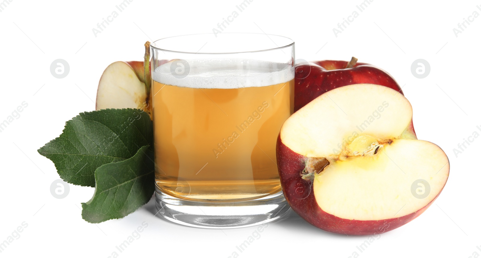 Photo of Delicious cider in glass near ripe apples on white background