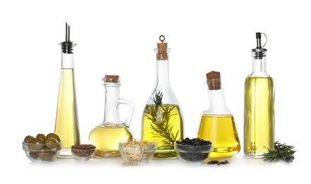 Photo of Different sorts of cooking oil and ingredients isolated on white