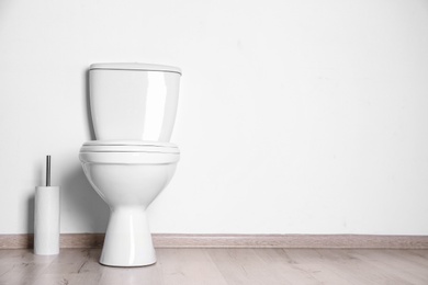 New ceramic toilet bowl in modern bathroom