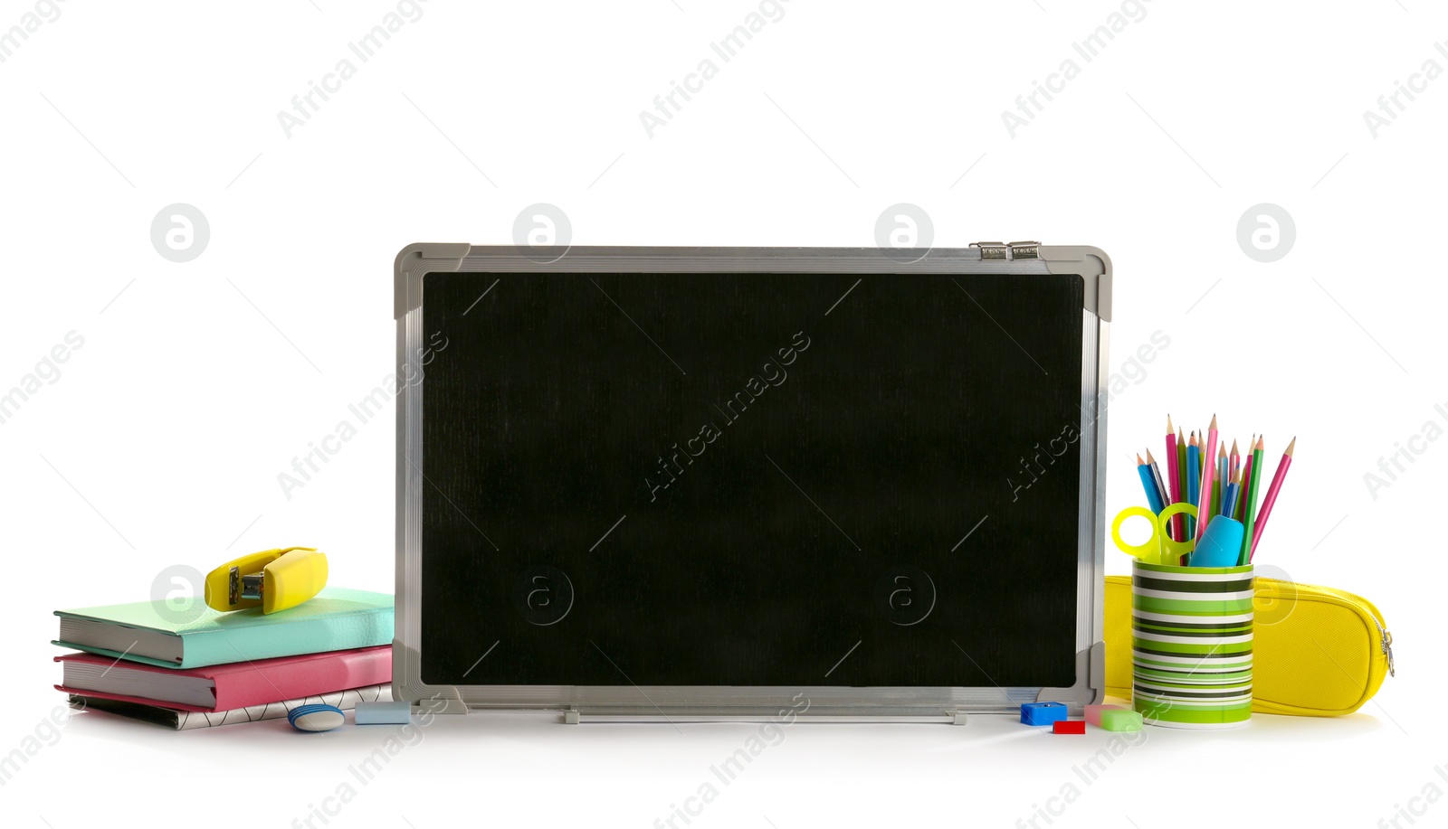 Photo of Small chalkboard and different school stationery on white background