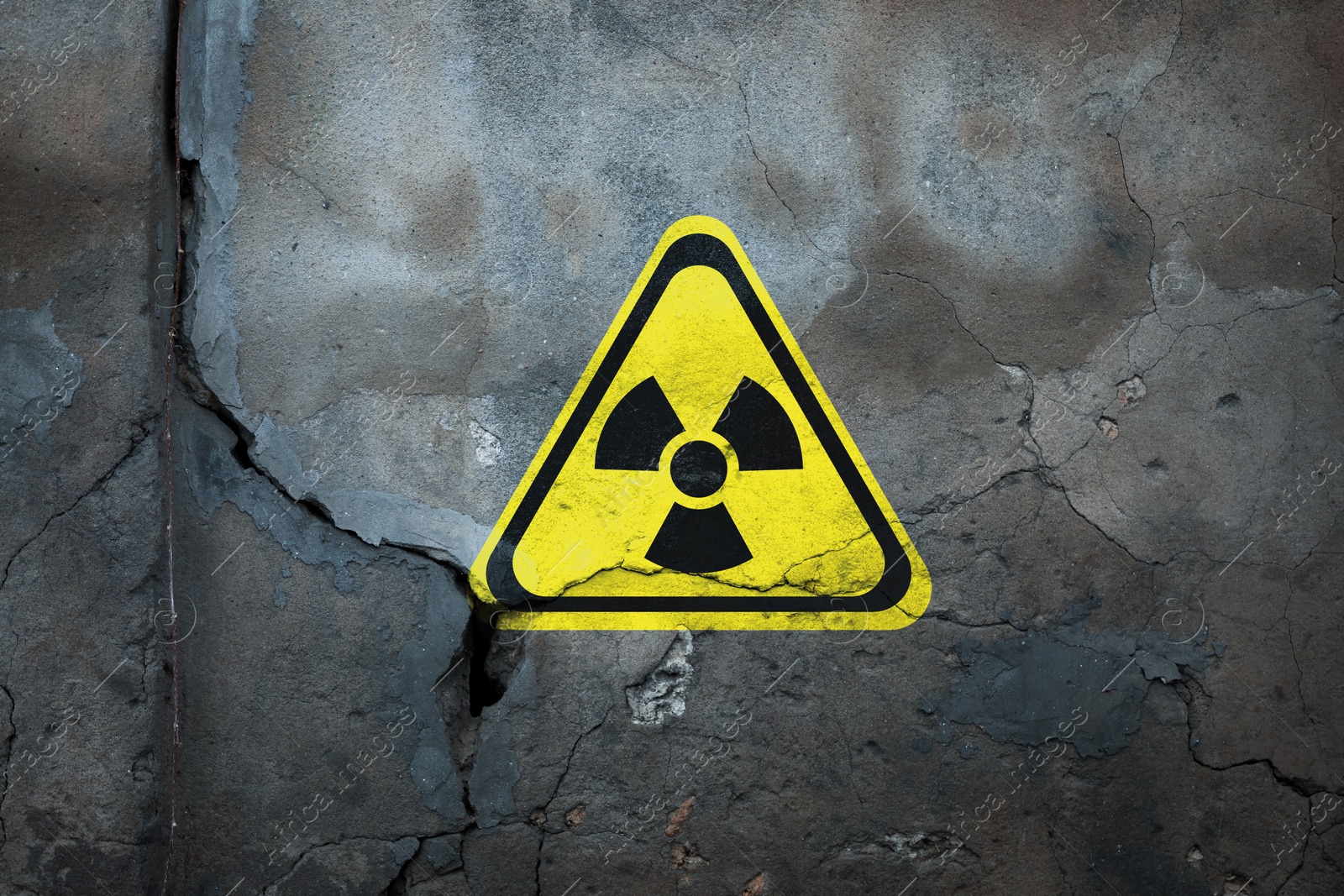 Image of Radioactive sign on old cracked wall. Hazard symbol