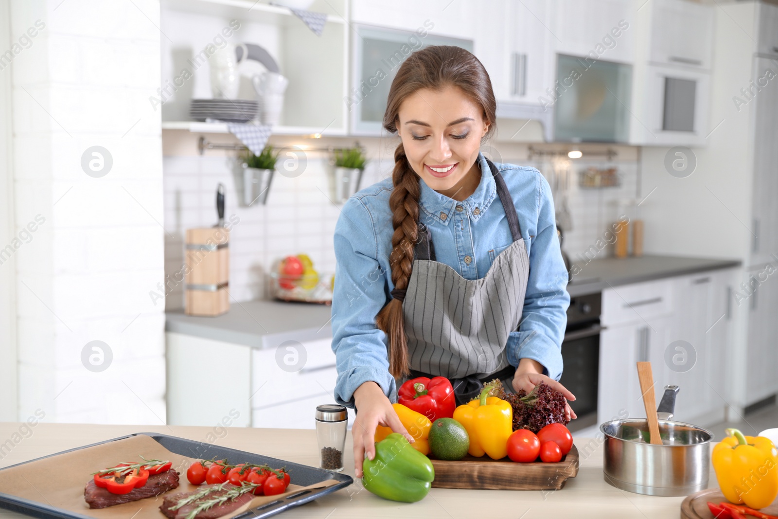 Photo of Professional chef in uniform working at restaurant kitchen