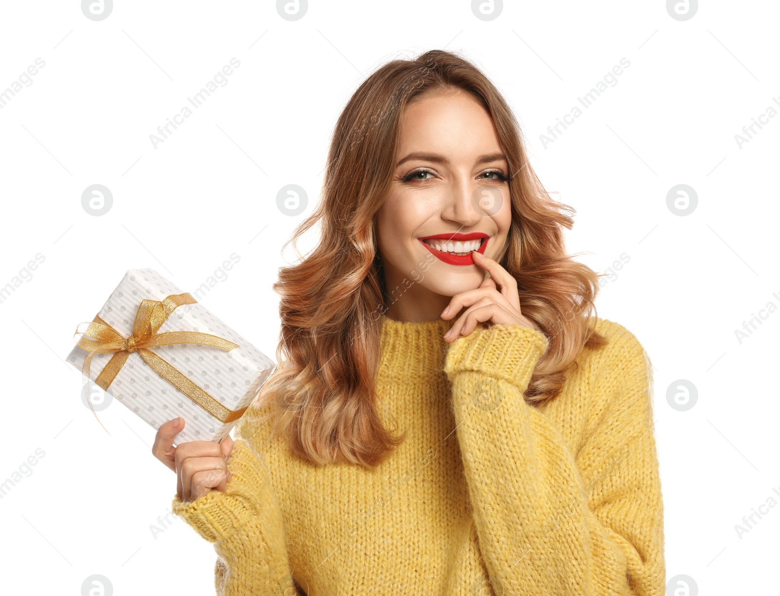 Photo of Happy young woman with Christmas gift on white background