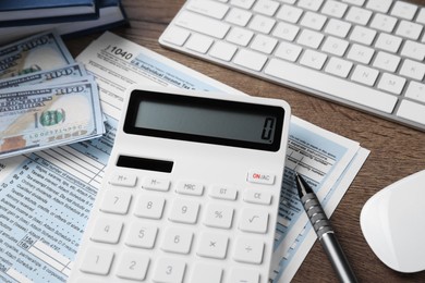 Photo of Tax accounting. Calculator, document, dollar banknotes and pen on table, closeup