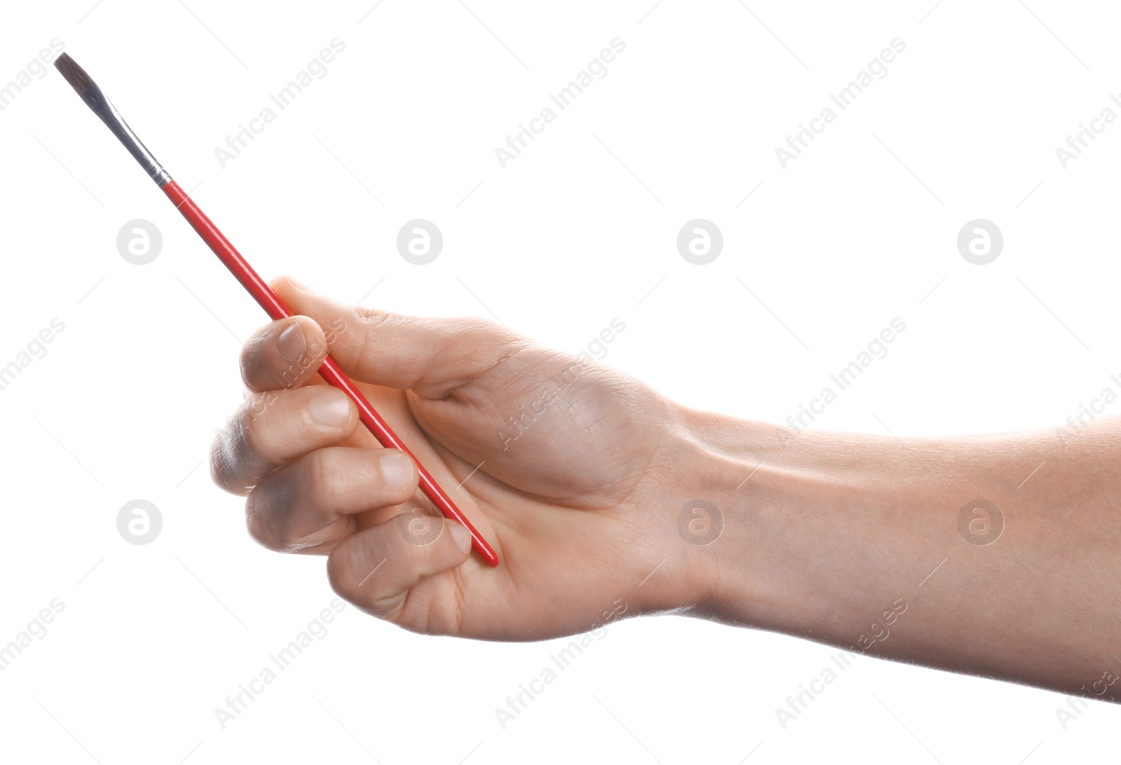 Photo of Man holding paint brush on white background, closeup