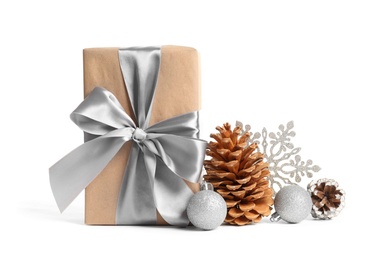 Photo of Beautifully wrapped gift box, pine cones and decorations on white background