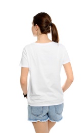 Photo of Young woman in t-shirt on white background. Mock up for design