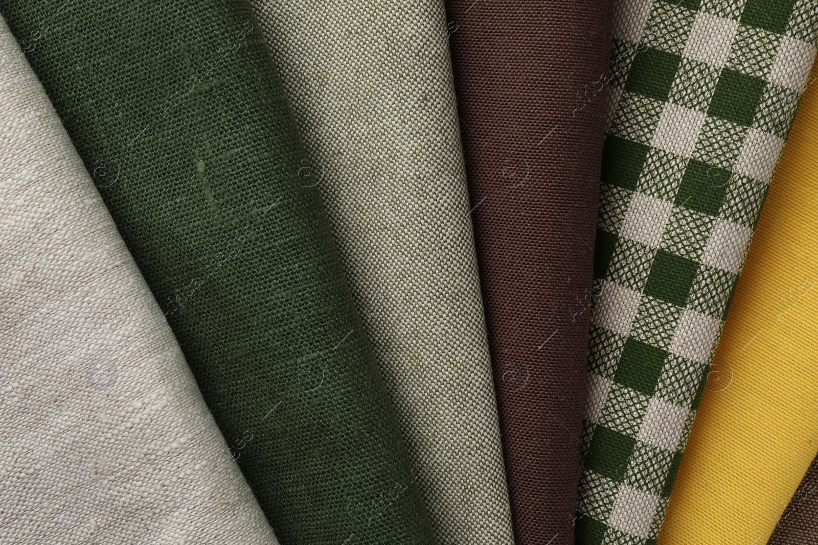 Photo of Many different fabrics as background, top view