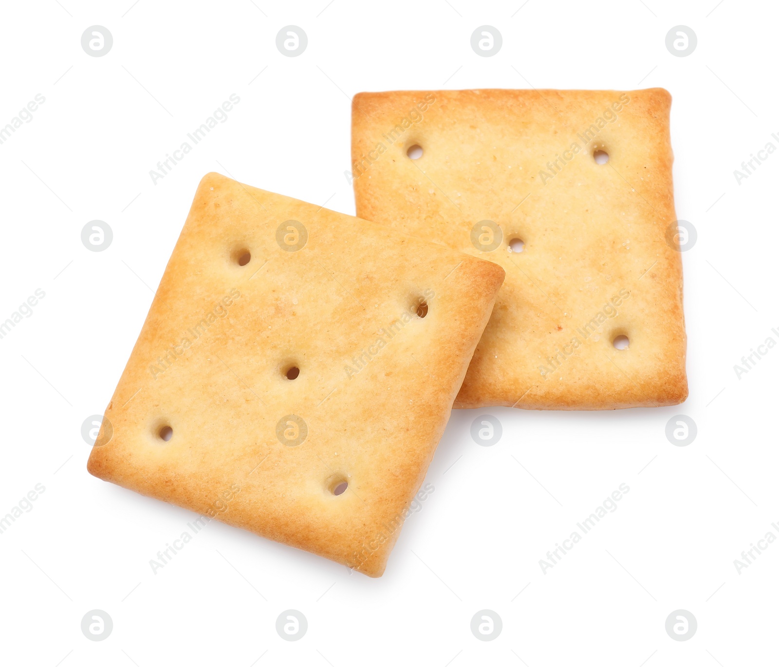 Photo of Two crispy crackers isolated on white, top view. Delicious snack