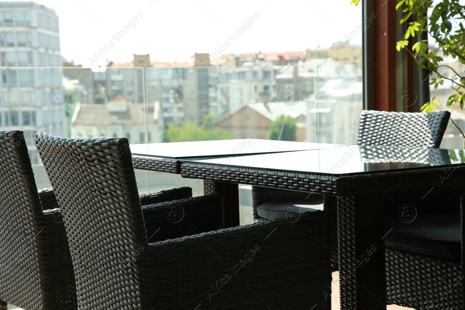 Photo of Observation area cafe. Table and chairs on terrace against beautiful cityscape