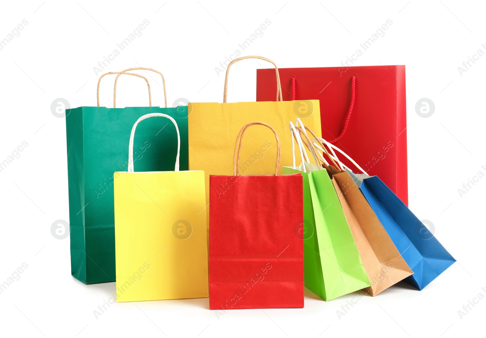 Photo of Colorful paper shopping bags on white background