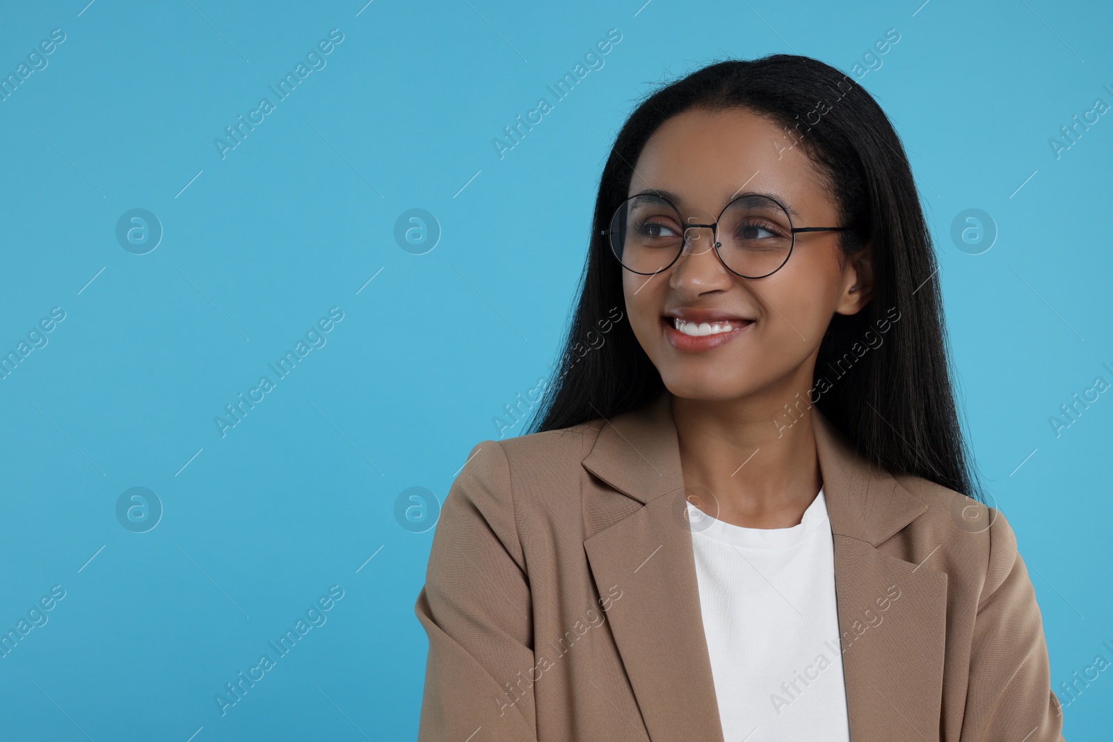 Photo of Beautiful secretary on light blue background, space for text