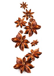 Image of Dry aromatic anise stars falling on white background