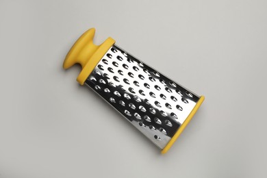 Photo of Modern grater on grey background, top view