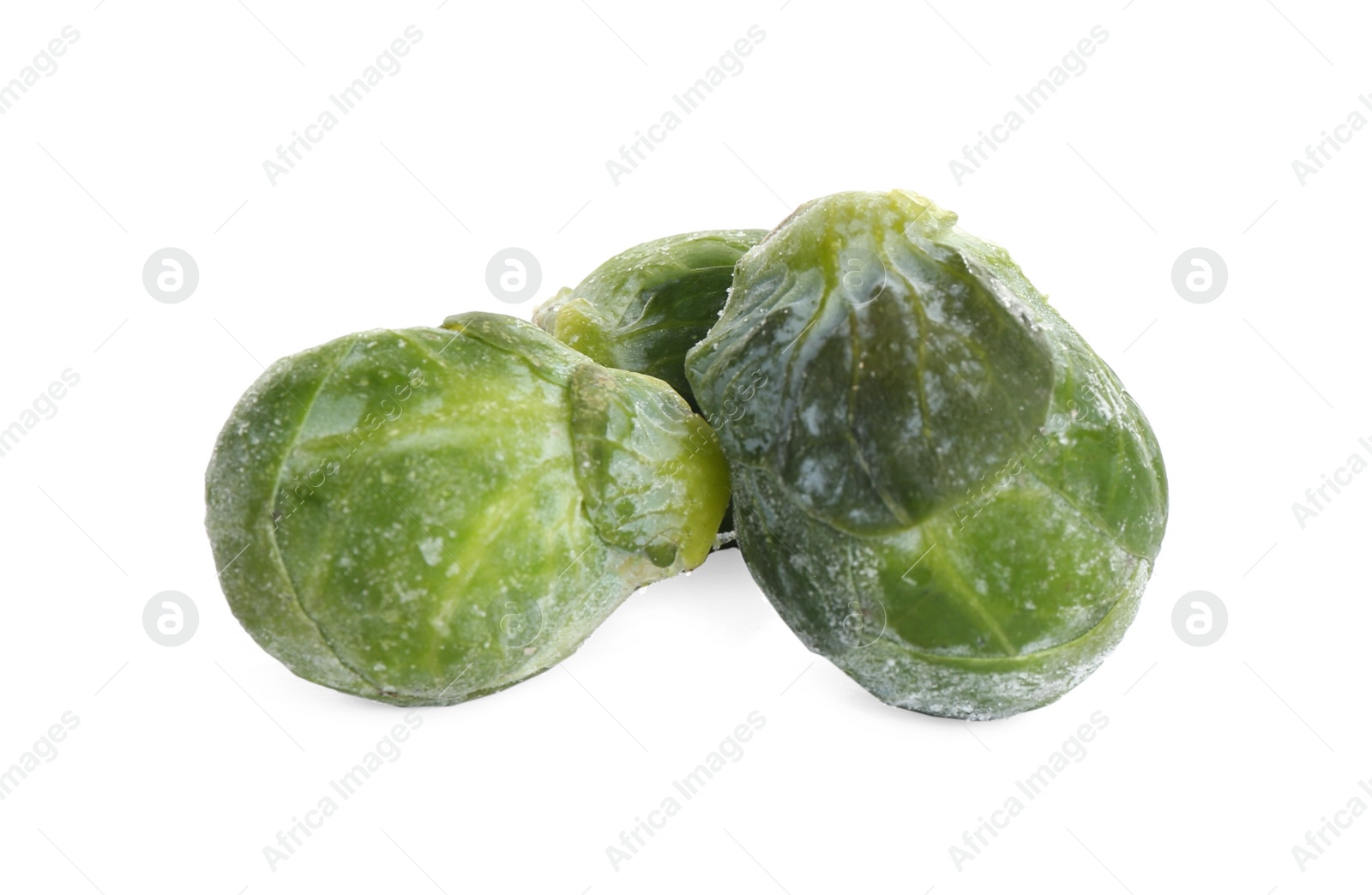 Photo of Frozen Brussels sprouts isolated on white. Vegetable preservation