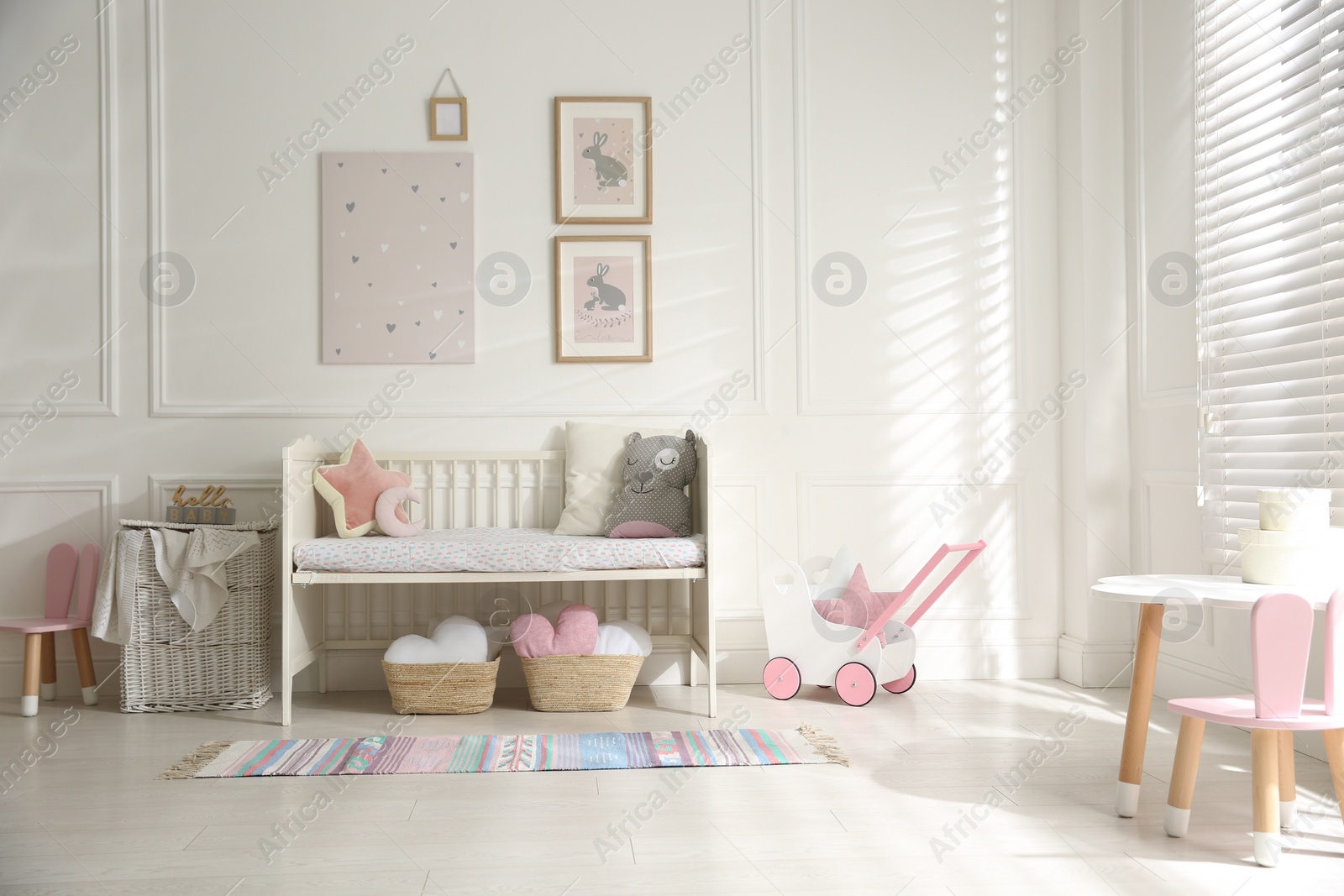 Photo of Baby room interior with stylish furniture and toys