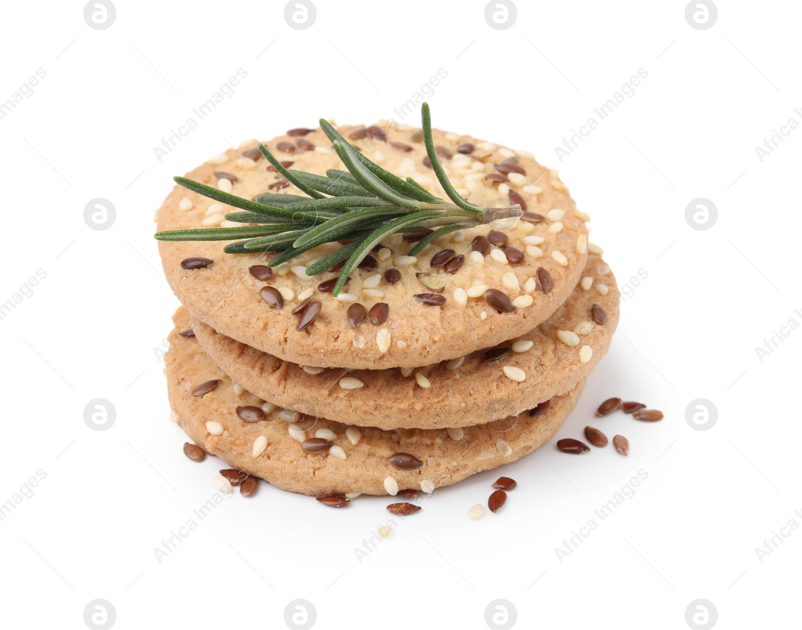 Photo of Stack of round cereal crackers with flax, sunflower, sesame seeds and rosemary isolated on white