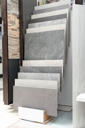 Many different samples of tiles on display in store