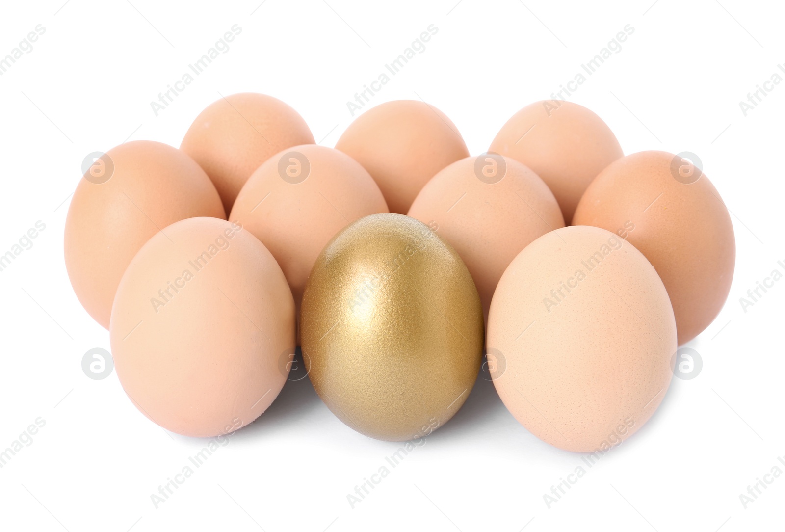 Photo of Golden egg among others on white background