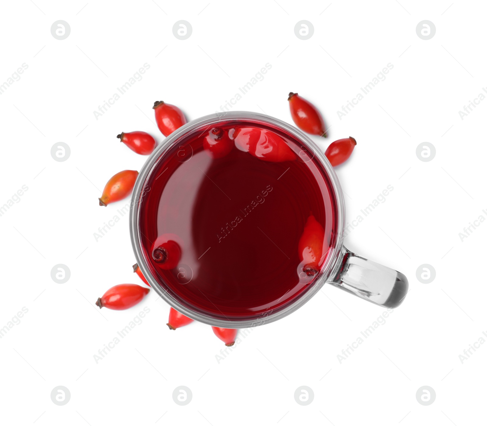 Photo of Aromatic rose hip tea and fresh berries on white background, top view