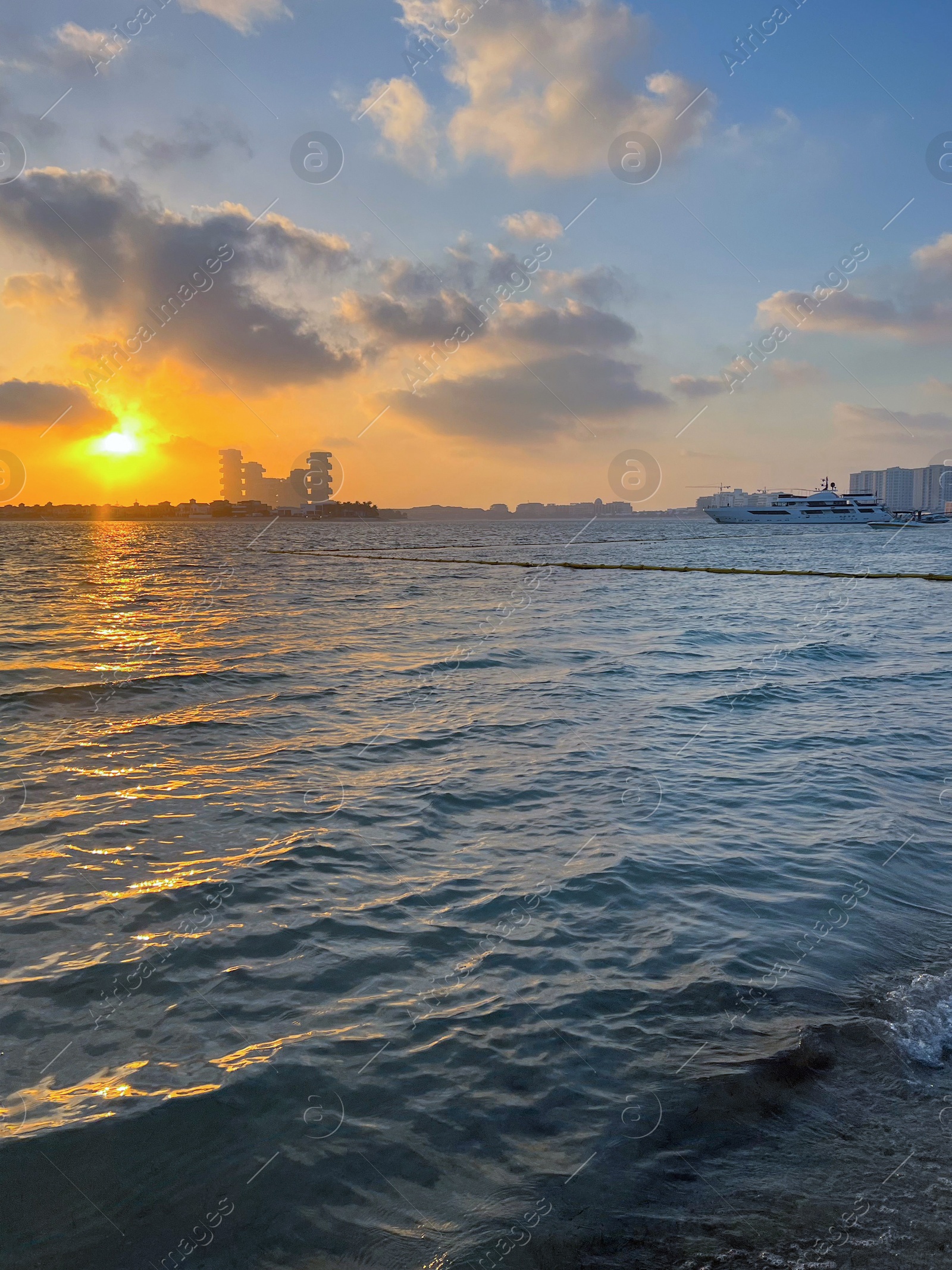 Photo of Beautiful view of sea and city at sunrise