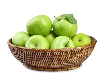 Wicker bowl of fresh green apples on white background