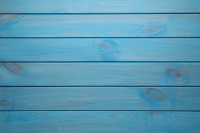 Texture of light blue wooden surface as background, top view