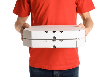 Young man with pizza boxes on white background. Food delivery service