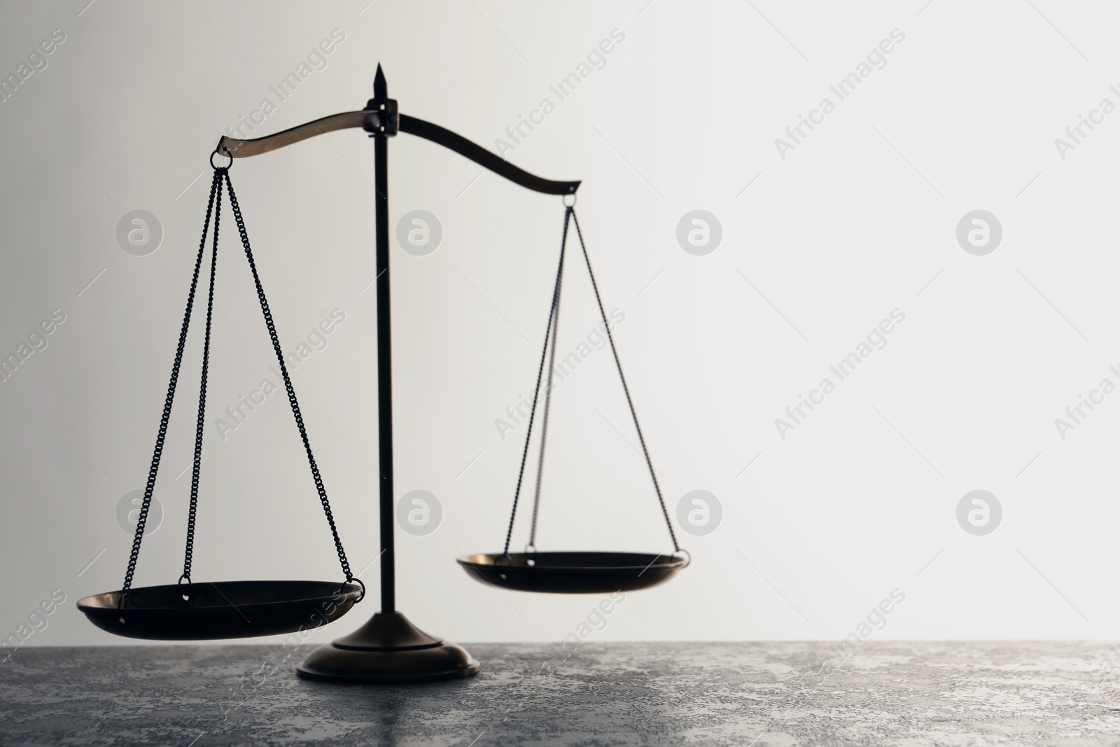 Photo of Scales of justice on table. Law concept