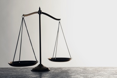 Photo of Scales of justice on table. Law concept