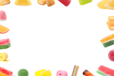 Image of Frame of different tasty candies on white background