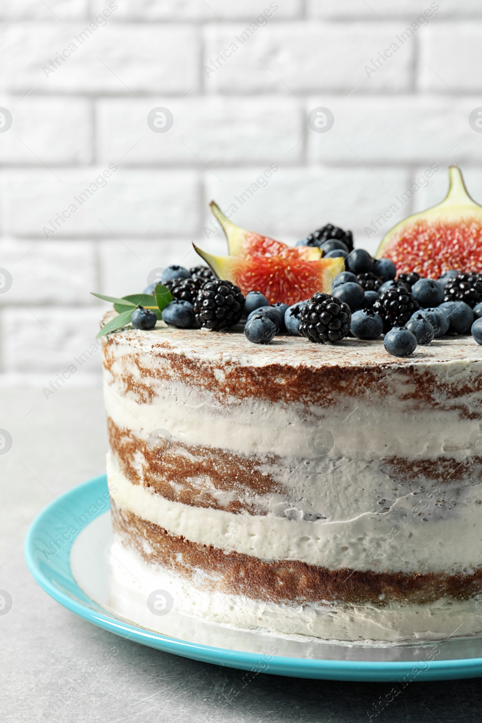 Photo of Delicious homemade cake with fresh berries on table, closeup