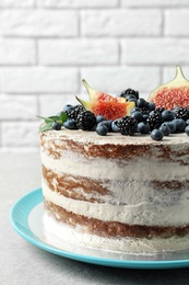 Delicious homemade cake with fresh berries on table, closeup