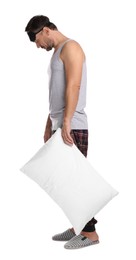 Photo of Man with pillow and eye mask in sleepwalking state on white background