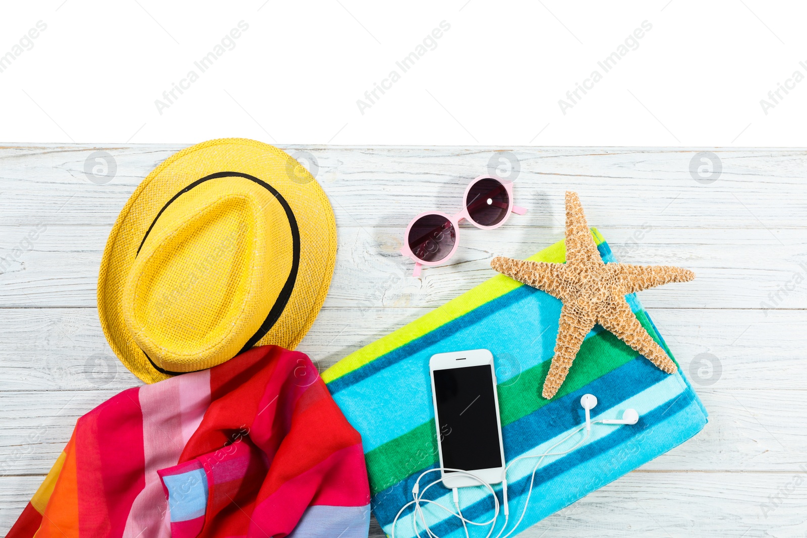 Photo of Flat lay composition with beach accessories on wooden background