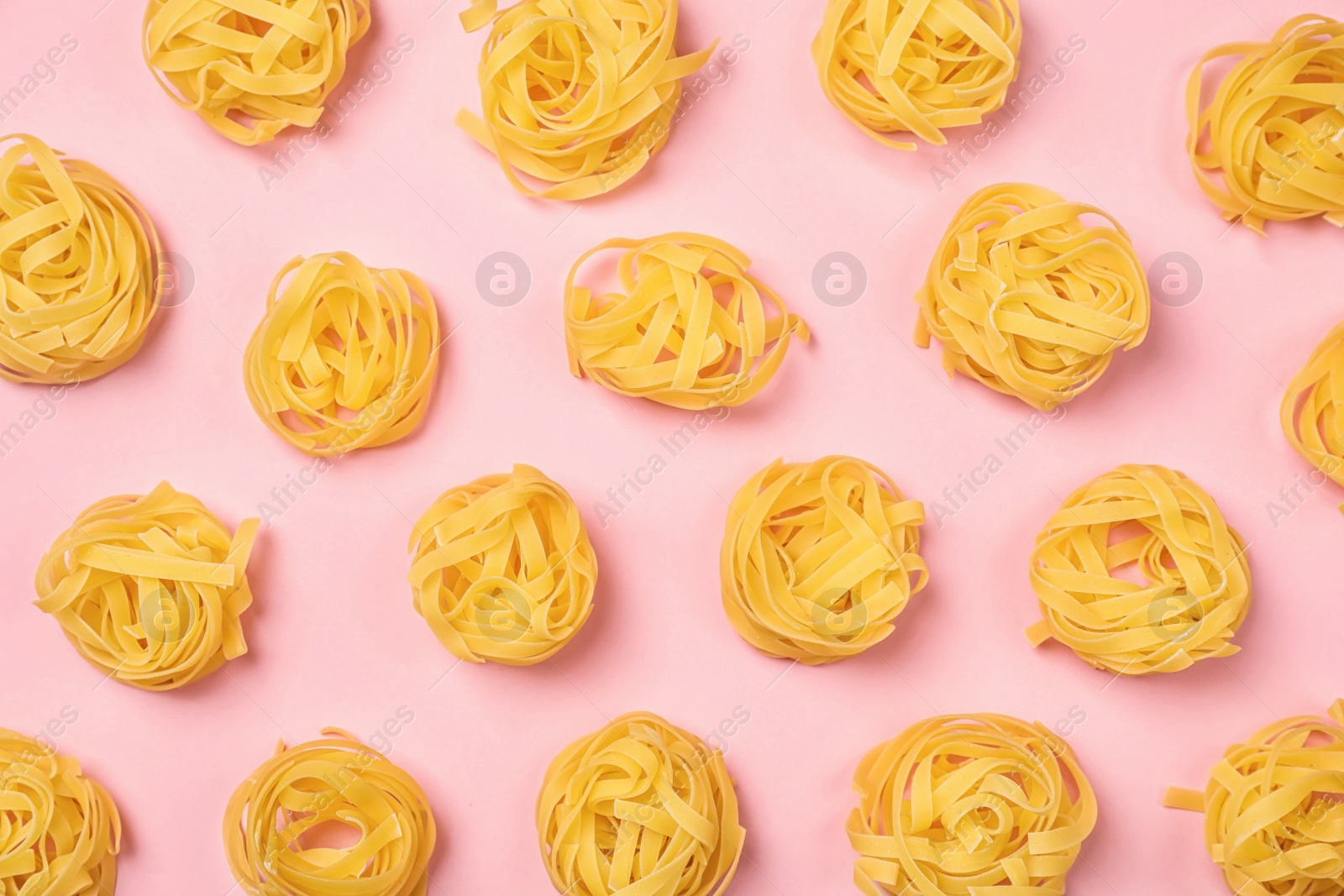 Photo of Flat lay composition with raw pasta on color background