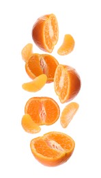 Image of Tasty fresh tangerines falling on white background