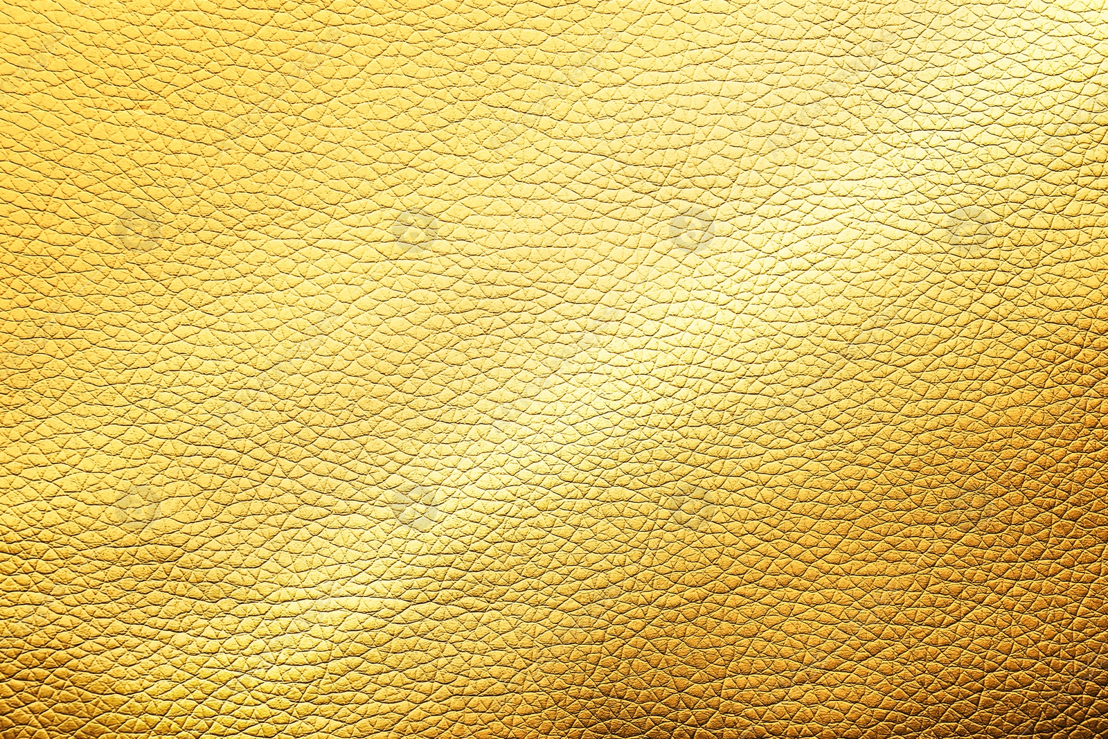 Image of Golden textured surface as background, closeup view