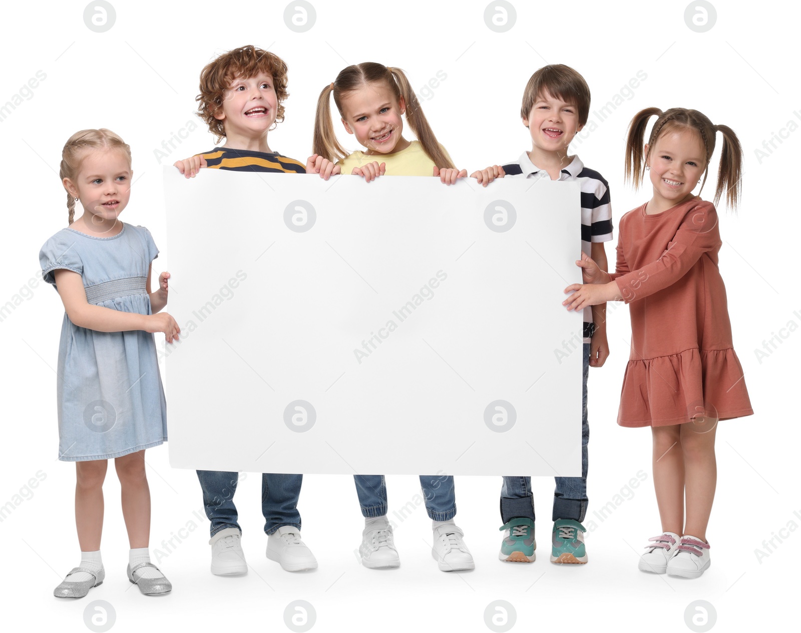 Photo of Group of children with blank poster on white background. Mockup for design