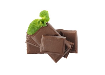 Tasty chocolate pieces and mint on white background, top view