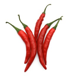 Photo of Red hot chili peppers isolated on white, top view