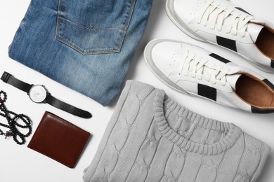 Stylish male autumn outfit and accessories on white background, flat lay. Trendy warm clothes