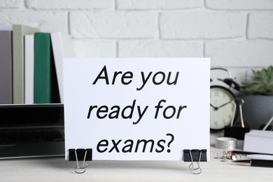 Photo of Paper with question Are you ready for exams on white wooden table