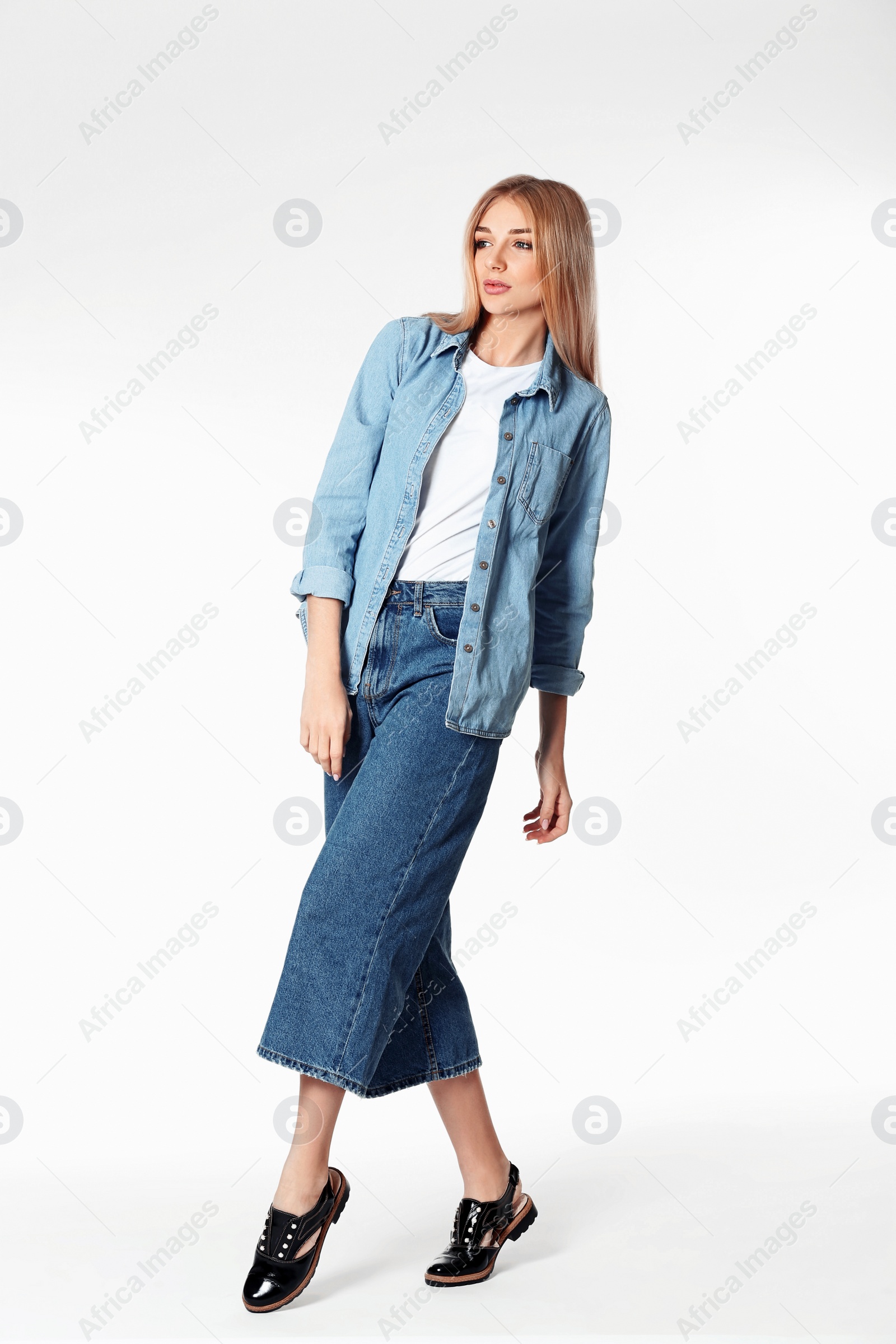 Photo of Full length portrait of woman in stylish shoes on white background